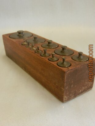 antique set of 12 copper weights in wooden block