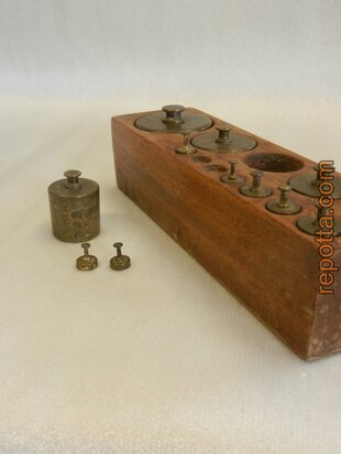 antique set of 12 copper weights in wooden block