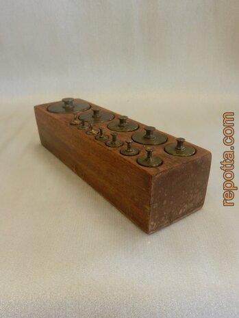 antique set of 12 copper weights in wooden block